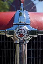 Picture of the front of our Maxim hood logo